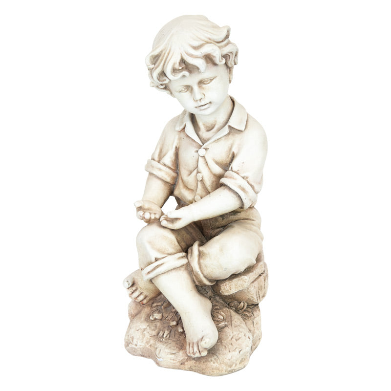 Boy Sitting On Rock Statue