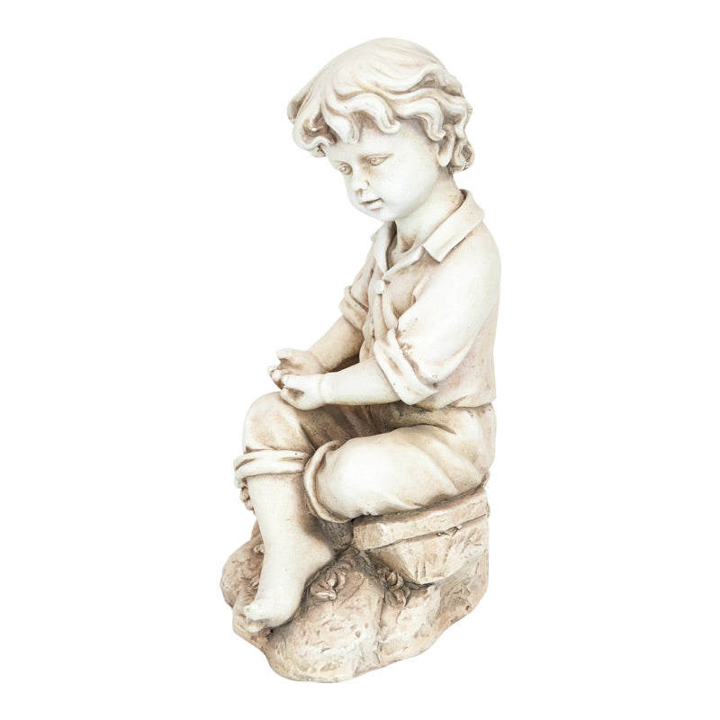Boy Sitting On Rock Statue