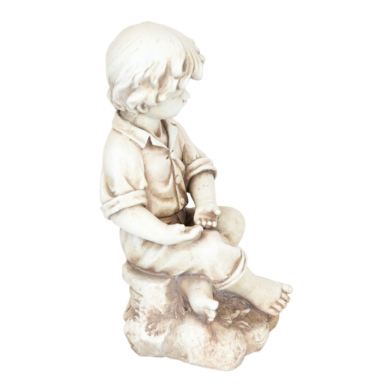 Boy Sitting On Rock Statue